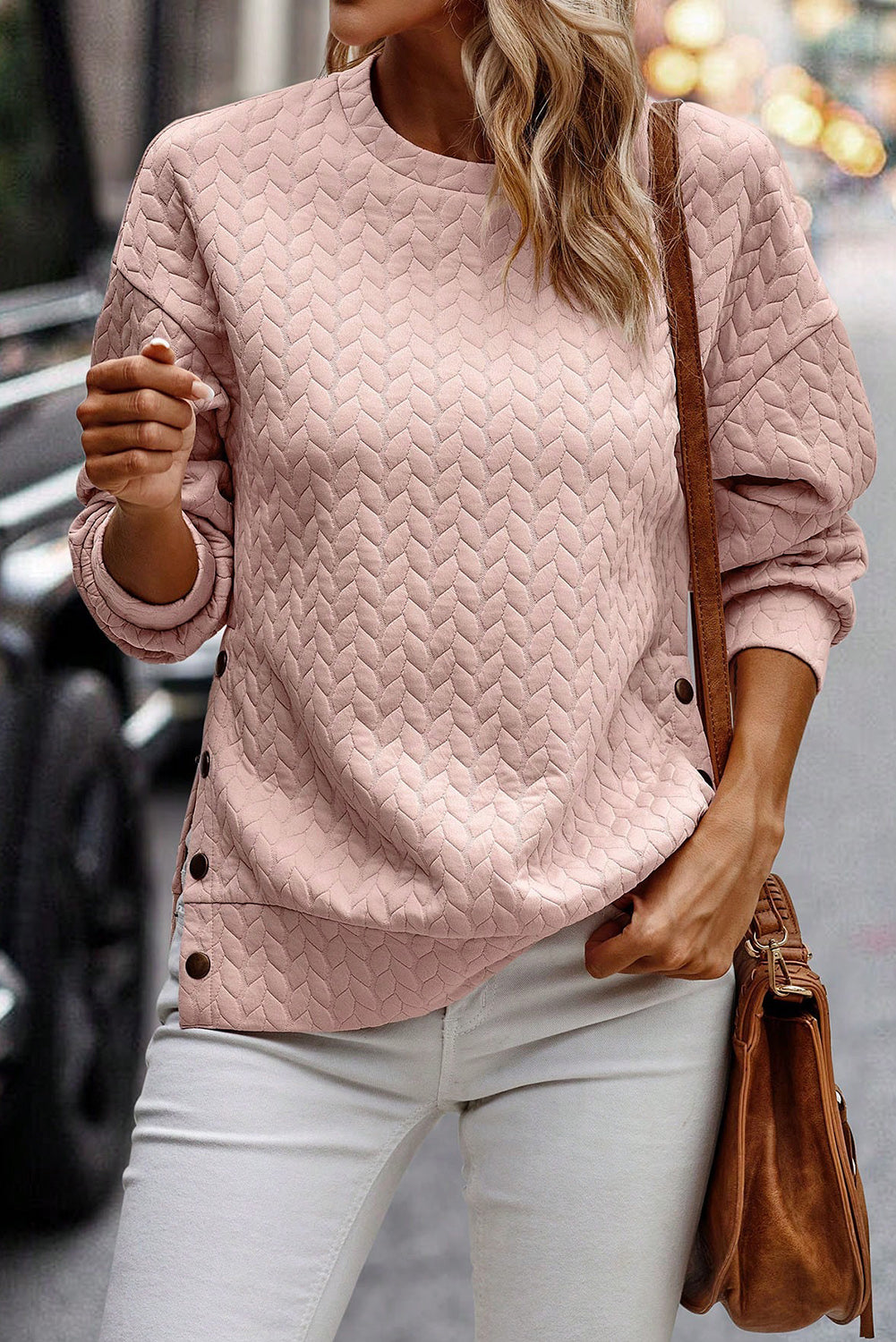 Schwarzer gesteppter Sweatshirt mit Druckknopfdetails und überschnittenen Schultern