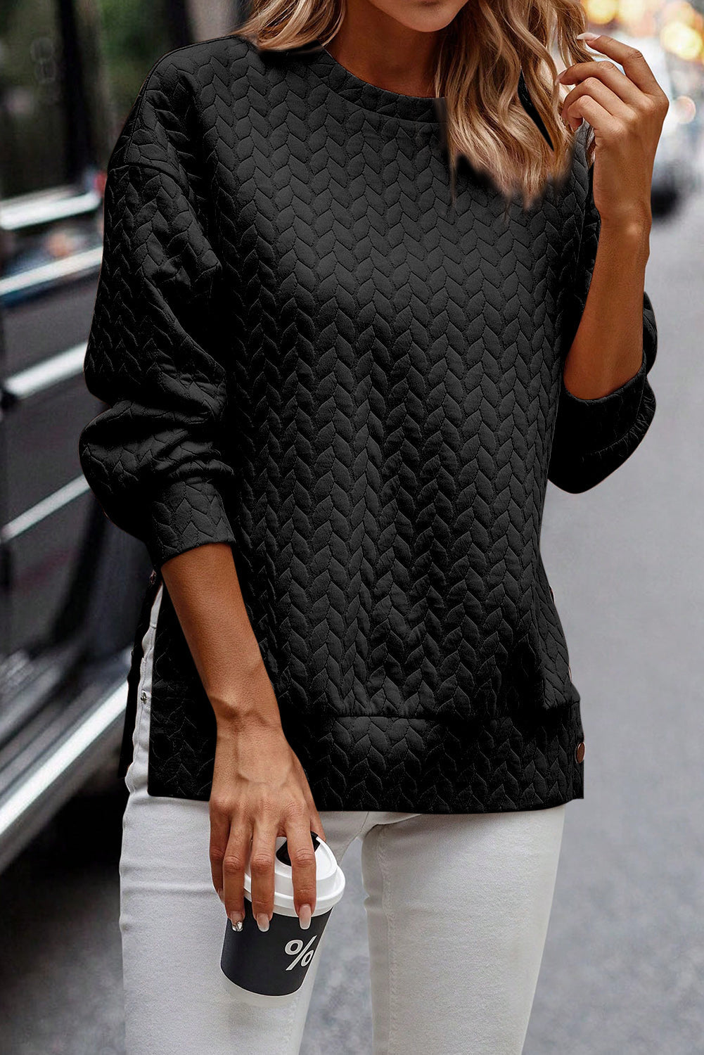 Schwarzer gesteppter Sweatshirt mit Druckknopfdetails und überschnittenen Schultern