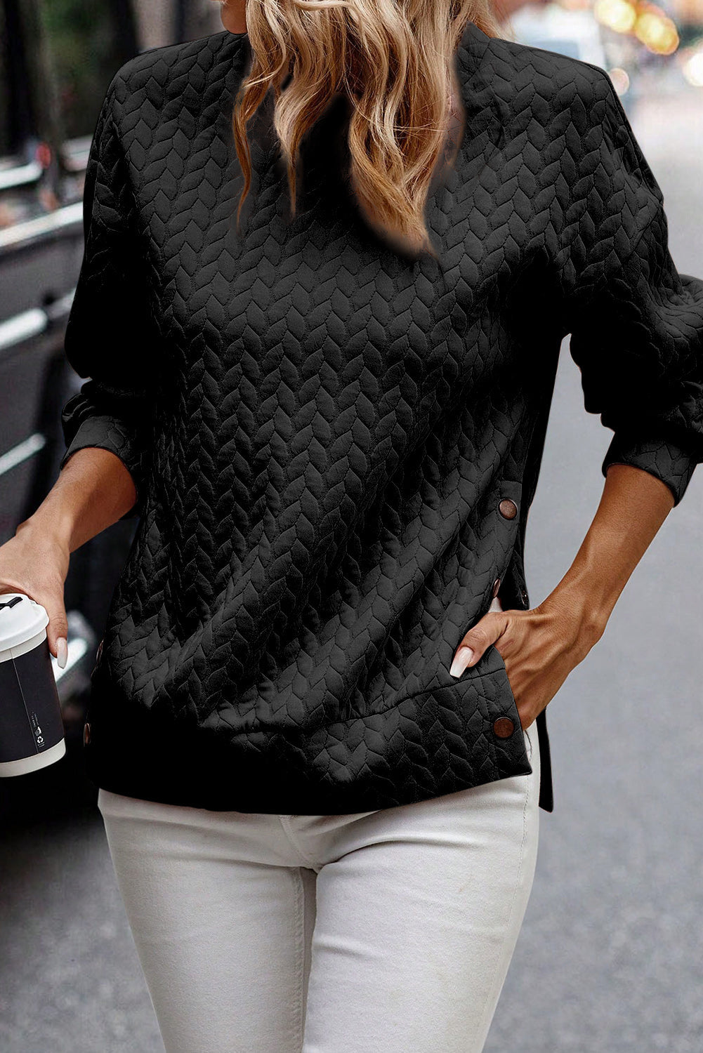Schwarzer gesteppter Sweatshirt mit Druckknopfdetails und überschnittenen Schultern