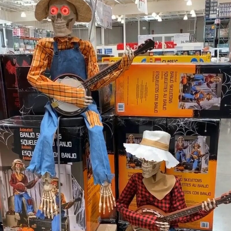 Lustiges animiertes duellierendes Banjo-Skelett