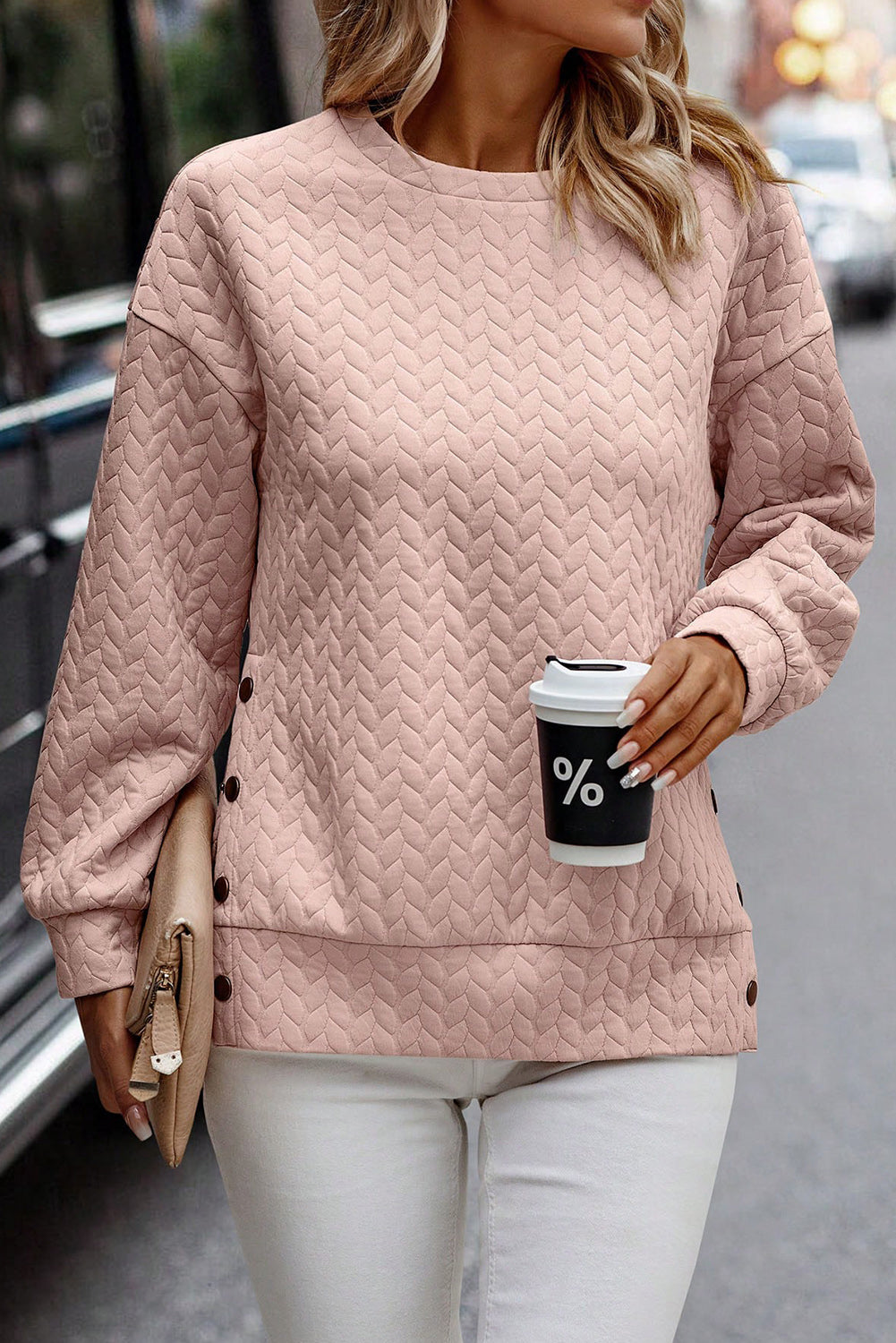 Schwarzer gesteppter Sweatshirt mit Druckknopfdetails und überschnittenen Schultern