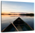 Sandsberg | Boot und Paddel an einem ruhigen See bei Sonnenuntergang Wandkunst