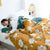 Boho-Steppdecke aus Baumwolle mit gelben Blumen