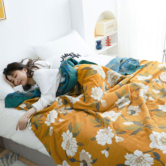 Boho-Steppdecke aus Baumwolle mit gelben Blumen