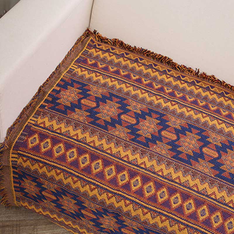 Bohemian Decke mit Quasten und Karomuster in verschiedenen Farben