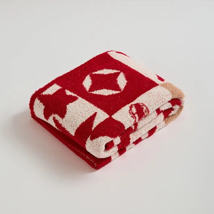 Gestrickte Überwurfdecke mit Urlaubsstimmung