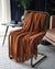 Boon – Gestrickte Überwurfdecken aus Tweed mit Zickzack-Struktur und Quasten
