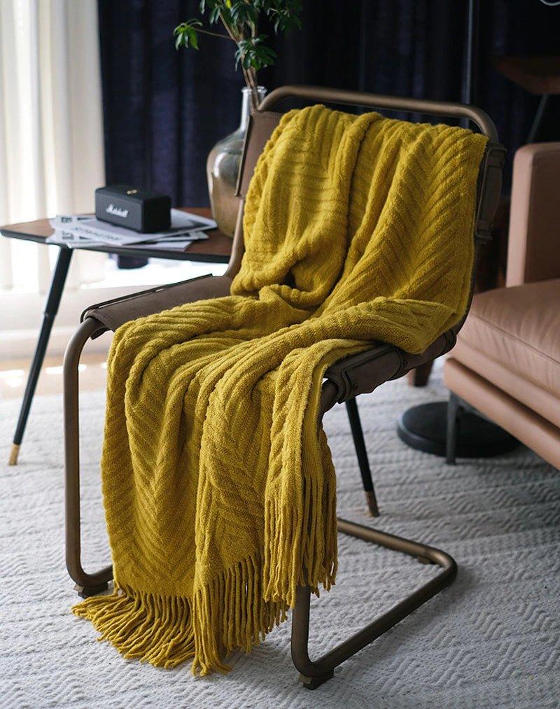 Boon – Gestrickte Überwurfdecken aus Tweed mit Zickzack-Struktur und Quasten