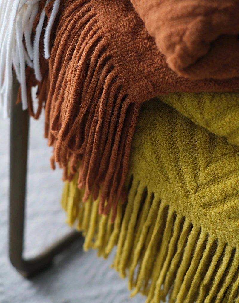Boon – Gestrickte Überwurfdecken aus Tweed mit Zickzack-Struktur und Quasten